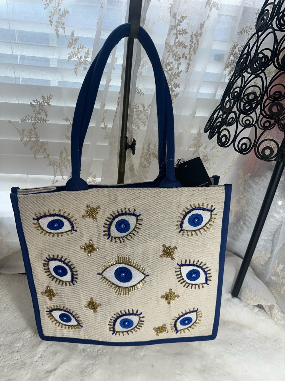 America & Beyond evil eye beaded gold and royal blue tote bag